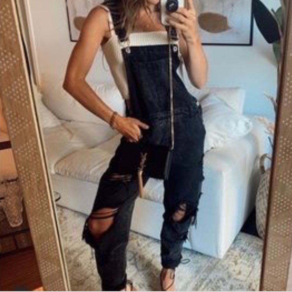 12TH TRIBE black denim distressed overalls.